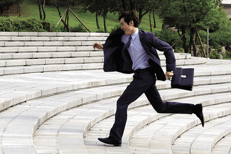 busy businessman dental patient running to appointment