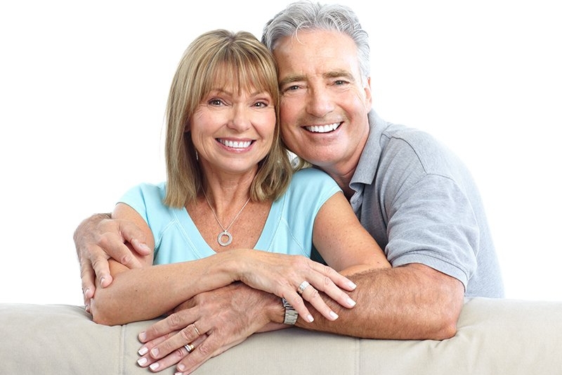 Senior Happy Couple With Dental Implants From Seven Springs Dental Excellence