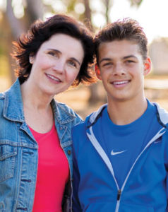 Woman smiling with kid