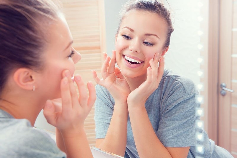 Woman looking in mirror