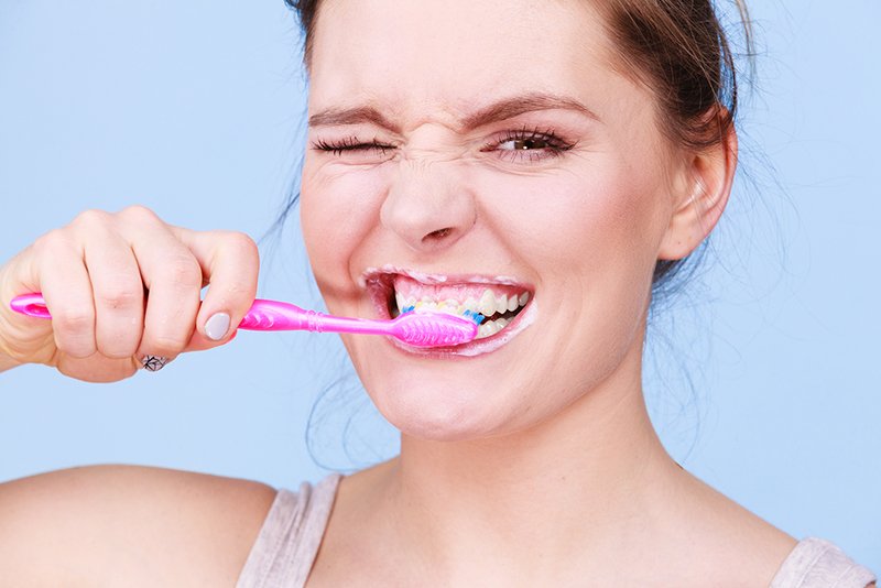 Woman Brushing Her Teeth